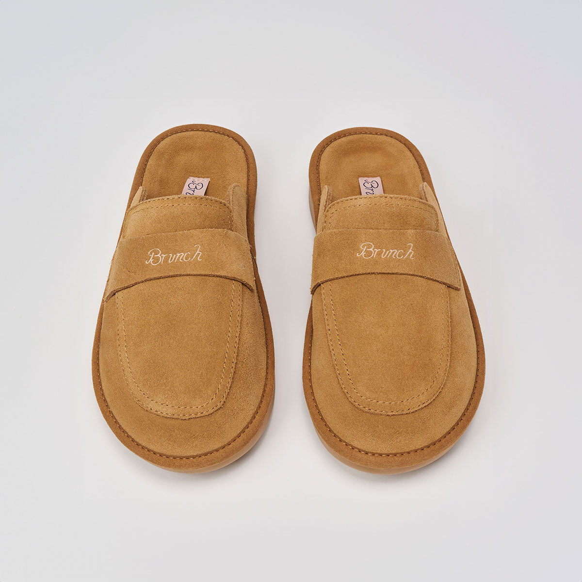 Top view of Loafer in Honey suede showing embroidered Brunch logo and backless slip-on design on light studio background