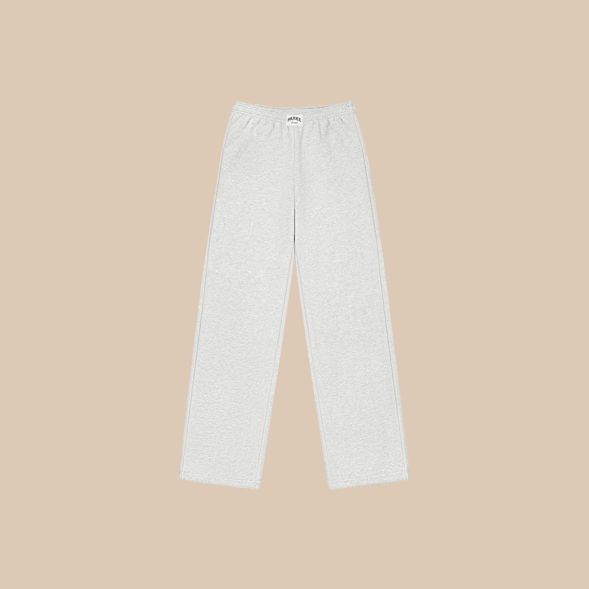 Flat lay of Parke sweatpants in classic grey fleece showing elastic waistband, straight leg and side pockets on beige background