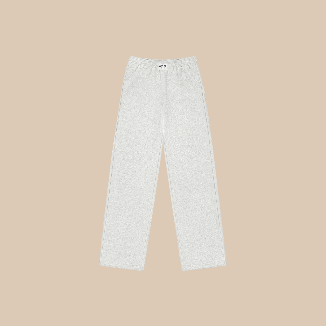 Flat lay of Parke sweatpants in classic grey fleece showing elastic waistband, straight leg and side pockets on beige background
