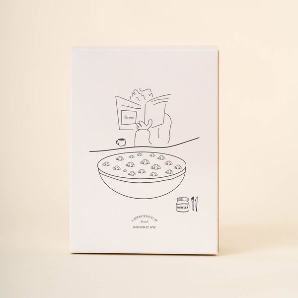 Front view of Petite Cereale au Nutella box with simple line drawing of a cereal bowl and small Nutella jar on cream background