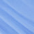Light blue cotton knit fabric with subtle diagonal folds and visible texture.