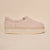 Side view of Puff XXL slipper in beige terry showing structured back and extra-thick platform sole on beige background