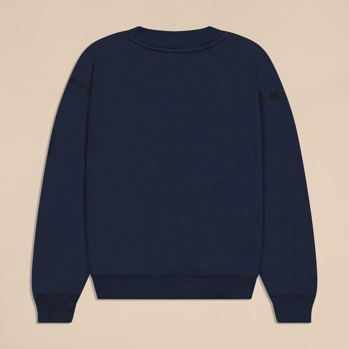 Back view of navy Varsity Crewneck in French terry showing ribbed neckline, cuffs, and hem on beige background