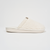 Side view of Essential slipper showcasing ribbed terry upper and branded rubber sole on white background